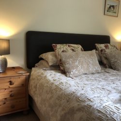 Exmoor Holidays - super-king bedroom has lovely garden views. Comfortable Marks and Spencers bed
